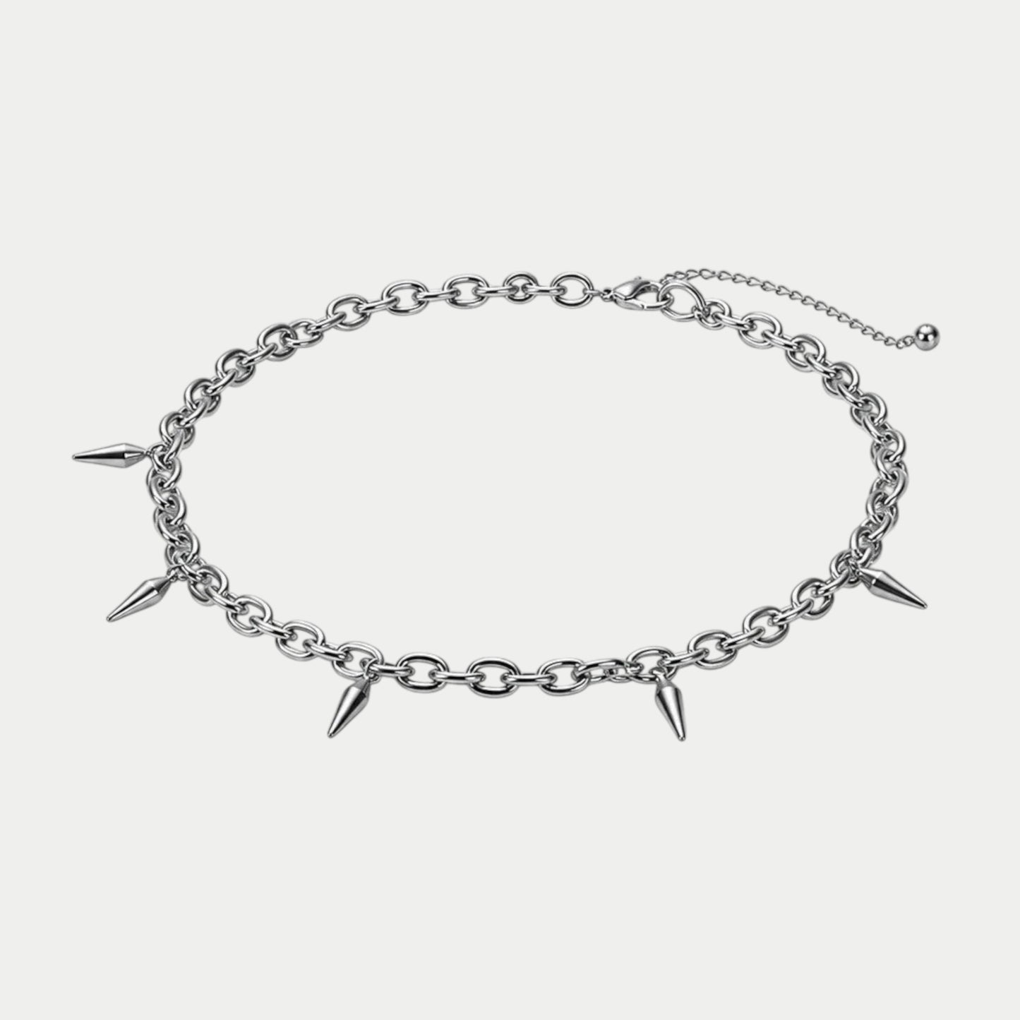 GOTHIC HOUR silver-tone chain necklace featuring pointed spike charms and an adjustable extension chain.