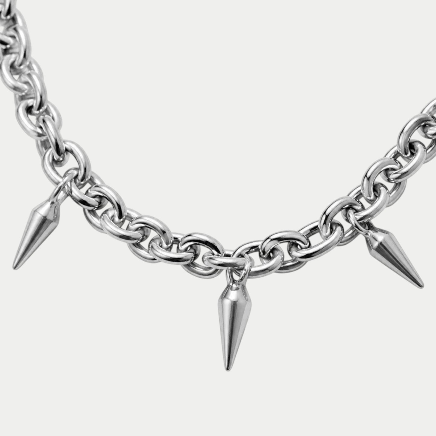 GOTHIC HOUR silver-tone chain necklace featuring sharp pointed spike charms for an alternative punk aesthetic.